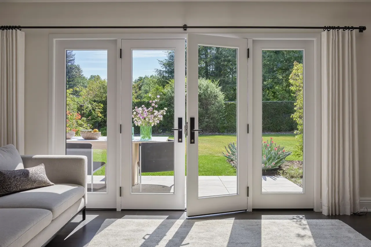 French doors opened onto a garden from a dining room